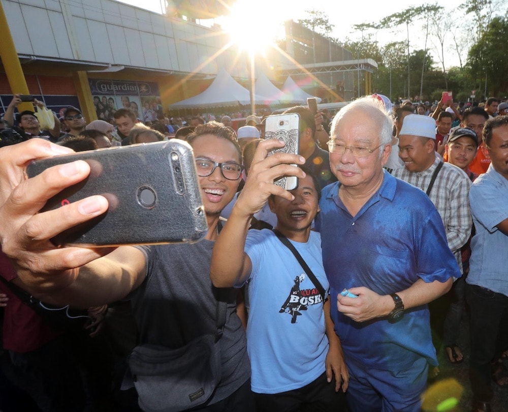 Datuk Seri Najib Razak takes a selfie with people in Sandakan May 10, 2019. u00e2u20acu201d Picture via Facebook/NajibRazak