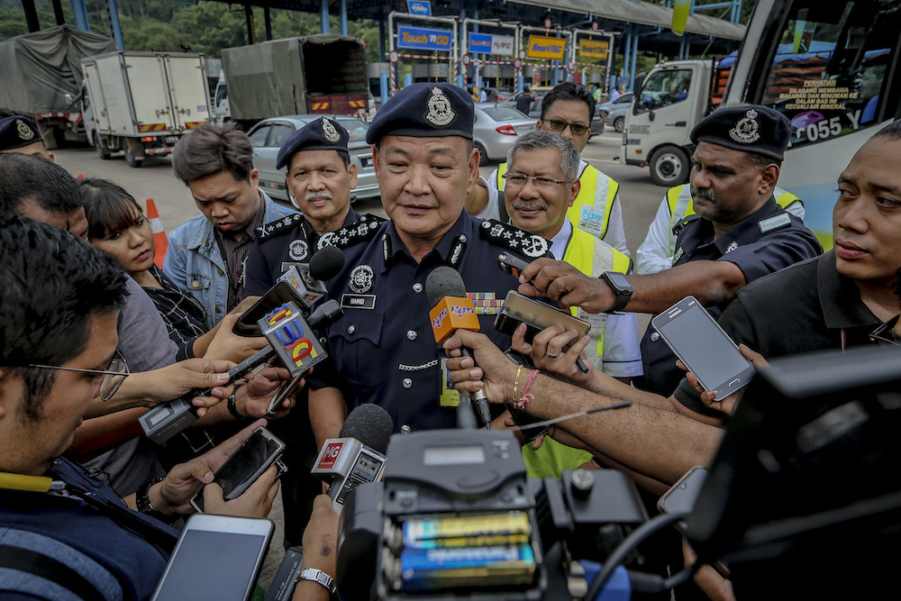 IGP Datuk Seri Abdul Hamid Bador speaks to reporters during the Balik Kampung Ops Selamat campaign in conjunction with Hari Raya Aidilfitri at Gombak toll June 3,2019. u00e2u20acu201d Picture by Firdaus Latif