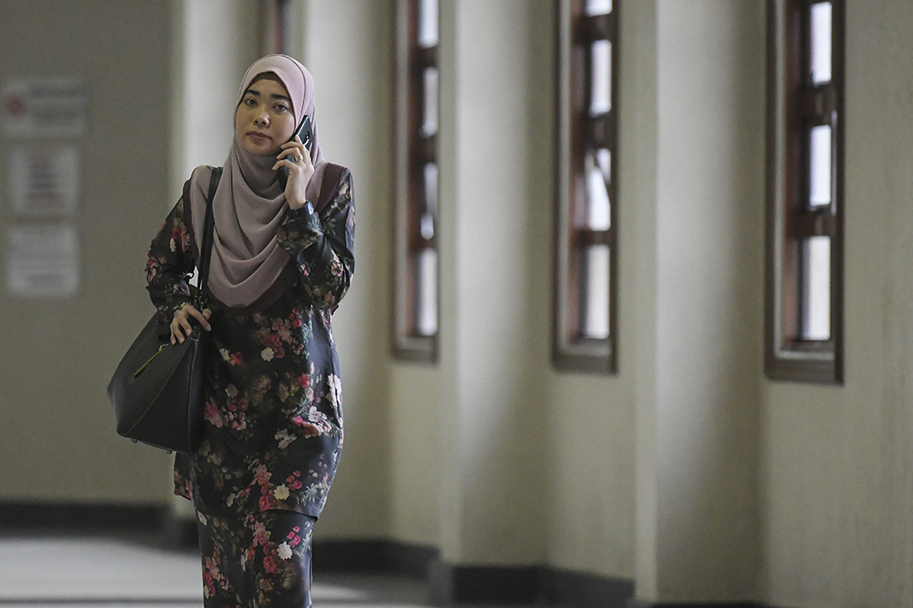 The Finance Ministryu00e2u20acu2122s Strategic Investment Department deputy secretary Afidah Azwa Abdul Aziz arrives at the Kuala Lumpur Courts Complex June 20, 2019. u00e2u20acu201d Picture by Miera Zulyana