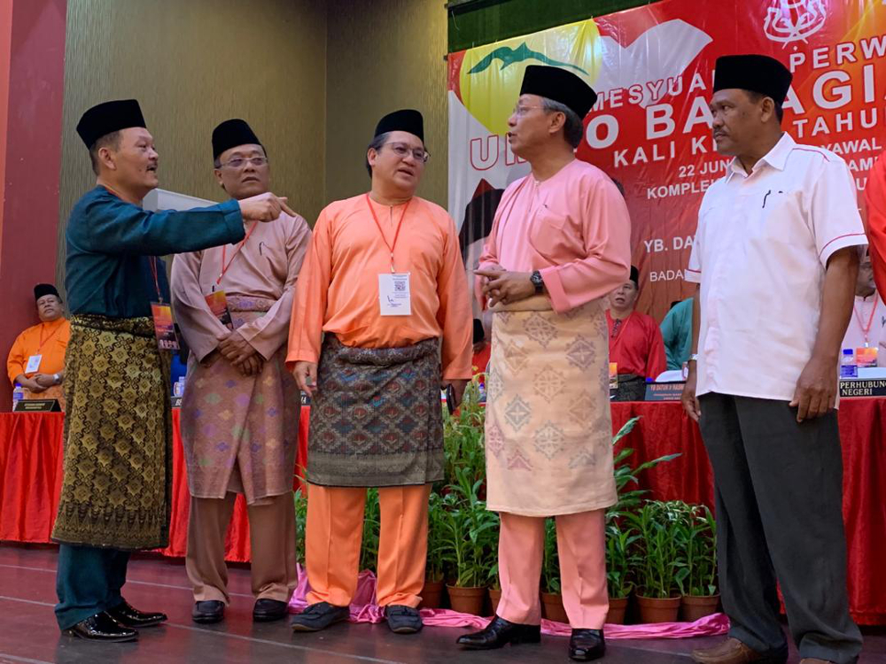 Johor Umno chief Datuk Hasni Mohammad (2nd right) and his deputy Datuk Nur Jazlan Mohamed (centre) during the Pulai Umno division meeting at the Dewan Tan Sri Mohamed Rahmat in Tampoi, Johor Baru June 22, 2019. u00e2u20acu201d Picture by Ben Tan