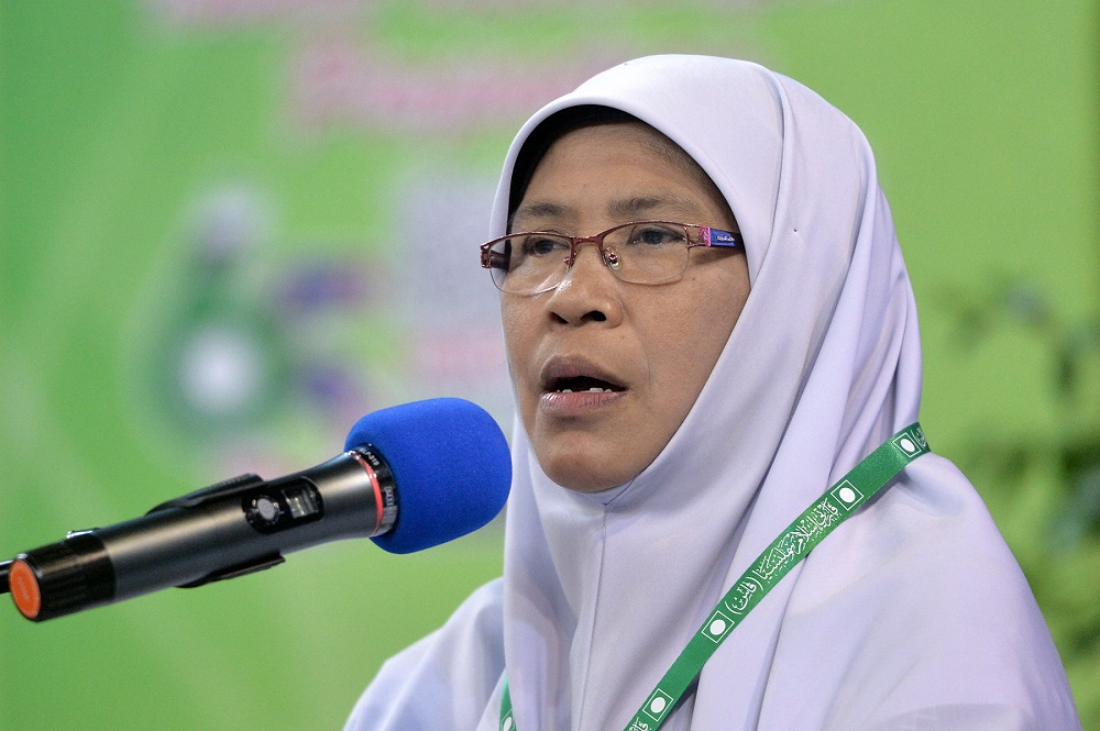 PAS' Dewan Muslimat representative Salamiah Md Noor delivers her speech during 65th Muktamar in Kuantan June 22, 2019. u00e2u20acu201d Picture by Mukhriz Hazim