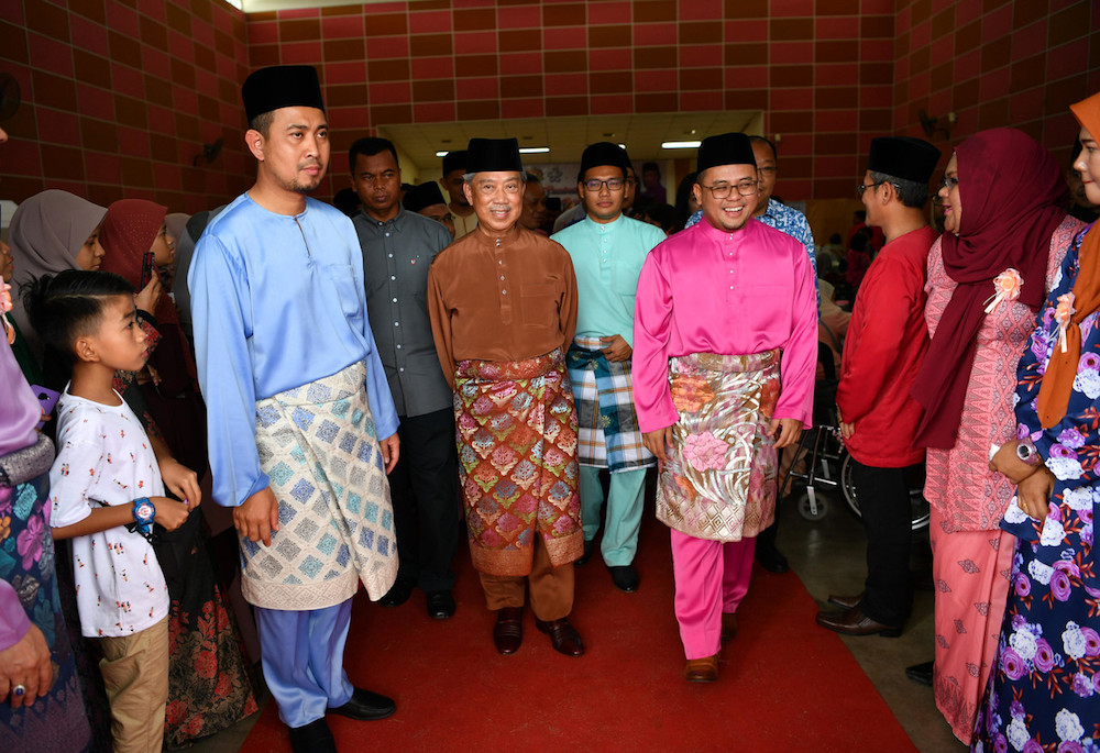 Johor Mentri Besar Dr Sahruddin Jamal, Home Minister Tan Sri Muhyiddin Yassin and Selangor Mentri Besar Amirudin Shari attend Aidilfitri celebrations at Dewan Orang Ramai Felda Sri Ledang in Pagoh June 7, 2019. u00e2u20acu201d Bernama pic