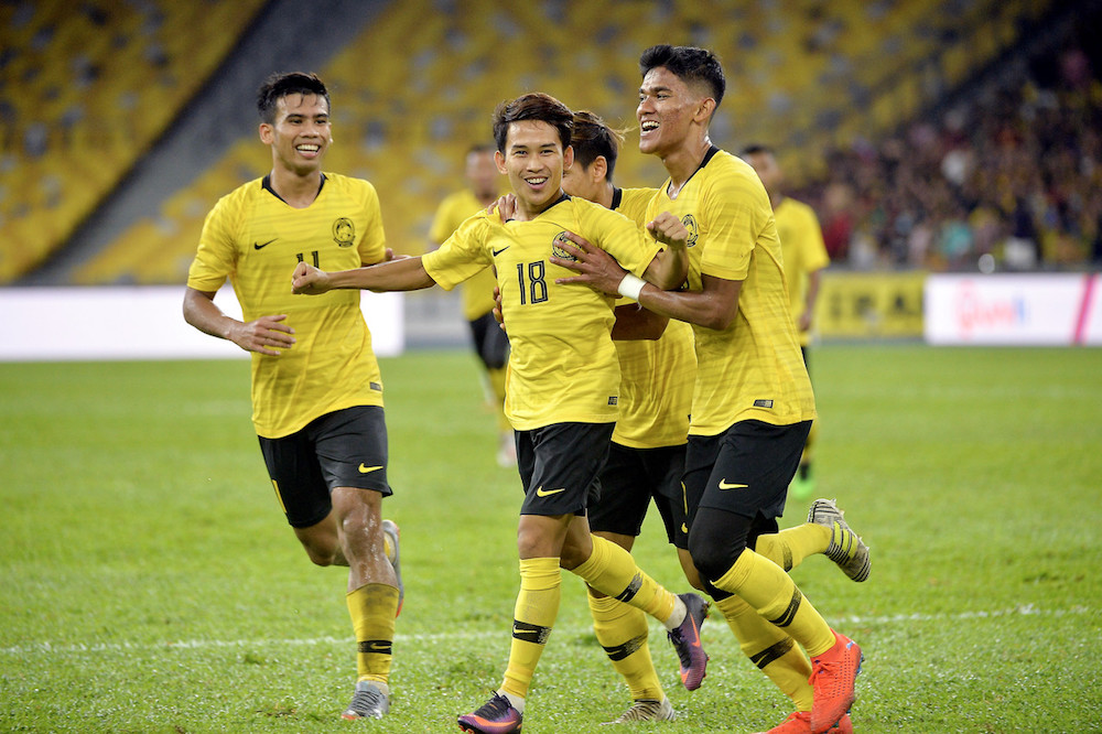 Malaysiau00e2u20acu2122s Mohd Faiz Nasir celebrates scoring a goal during their match with Timor Leste during the first leg of the 2022 World Cup/2023 Asian Cup first round qualifiers in Kuala Lumpur June 7, 2019. u00e2u20acu201d Bernama pic