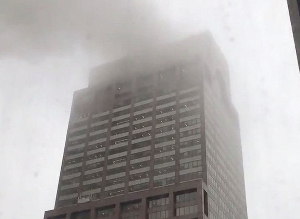 Smoke is seen rising from a building after a helicopter crash in New York City June 10, 2019. u00e2u20acu201d Image from Lance Koonce via Reuters