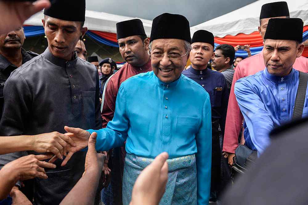 Prime Minister Tun Dr Mahathir Mohamad greets visitors to his Raya Open House at Seri Perdana, Putrajaya June 5, 2019. u00e2u20acu201d Picture by Miera Zulyana