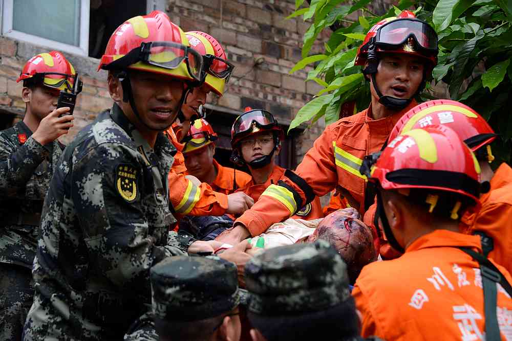 Rescue workers carry an injured man on a stretcher after earthquakes hit Changning county in Yibin, Sichuan province, China June 18, 2019. u00e2u20acu201d Reuters pic