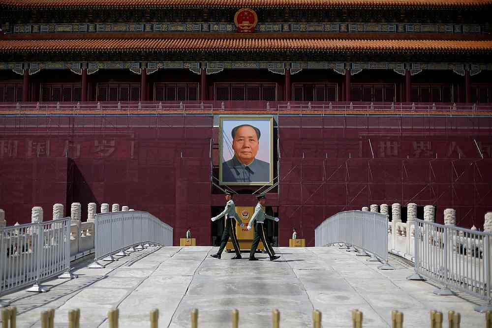 Paramilitary officers change guard in front of the portrait of the late Chinese chairman Mao Zedong in Tiananmen Square in Beijing May 7, 2019. u00e2u20acu201d Reuters pic
