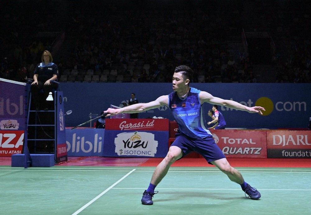 Lee Zii Jia of Malaysia hits a return against Cheng Long of China during their menu00e2u20acu2122s singles round two match at the Badminton Indonesia Open tournament in Jakarta July 18, 2019. u00e2u20acu201d AFP pic