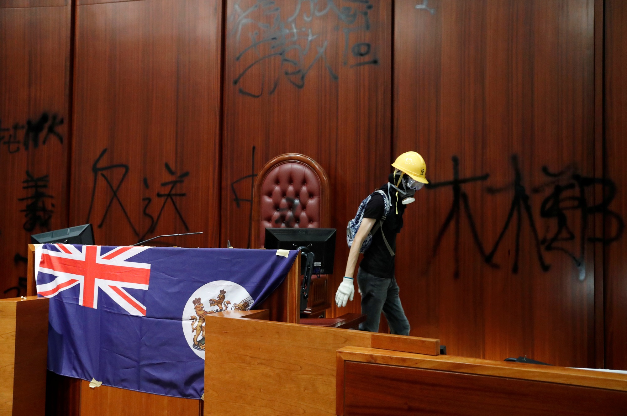 Colonial flag of Hong Kong is displayed inside a chamber after protesters broke into the Legislative Council building during the anniversary of Hong Kong's handover to China in Hong Kong, China July 1, 2019. REUTERS/Tyrone Siu