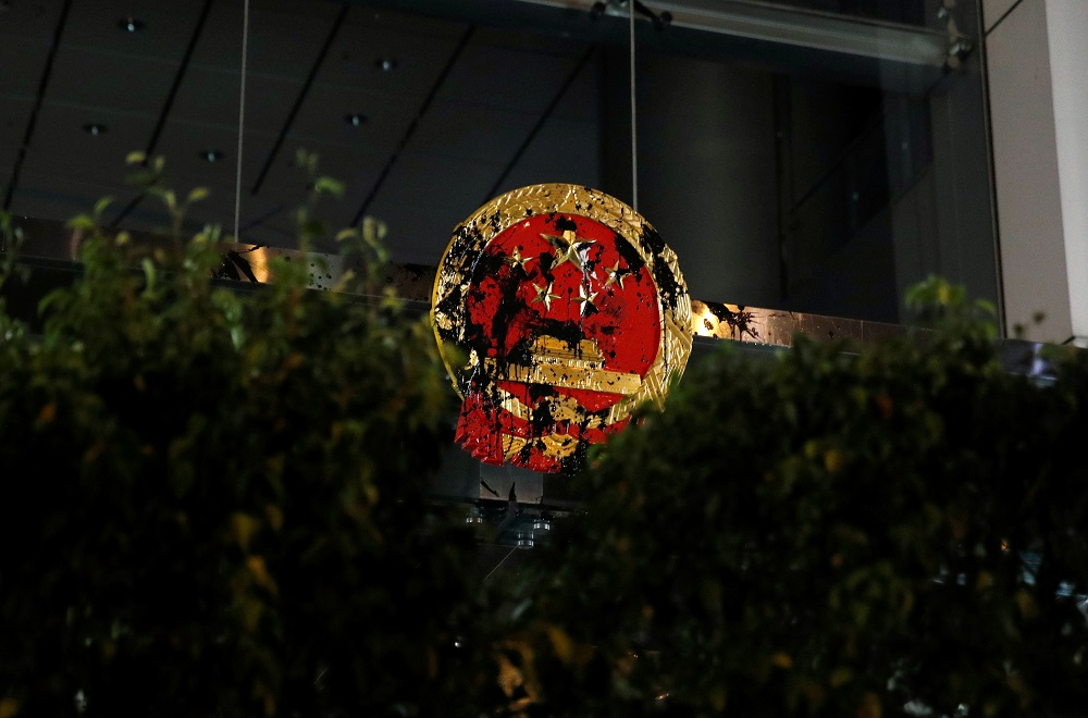 A National Emblem of the People's Republic of China is seen vandalised on Chinese Liaison Office after a march to call for democratic reforms, in Hong Kong, China July 21, 2019. REUTERS/Edgar Su