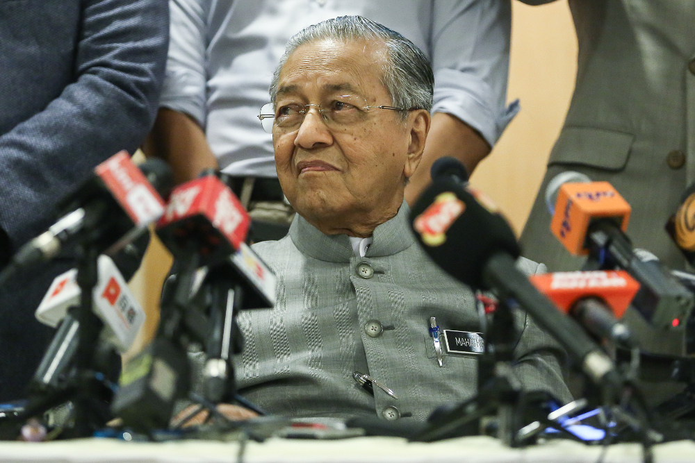Prime Minister Tun Dr Mahathir Mohamad (centre) speaks during a press conference after chairing the Pakatan Harapan Presidential Council meeting at Yayasan Kepimpinan Perdana in Putrajaya July 8, 2019. u00e2u20acu201d Picture by Yusof Mat Isa