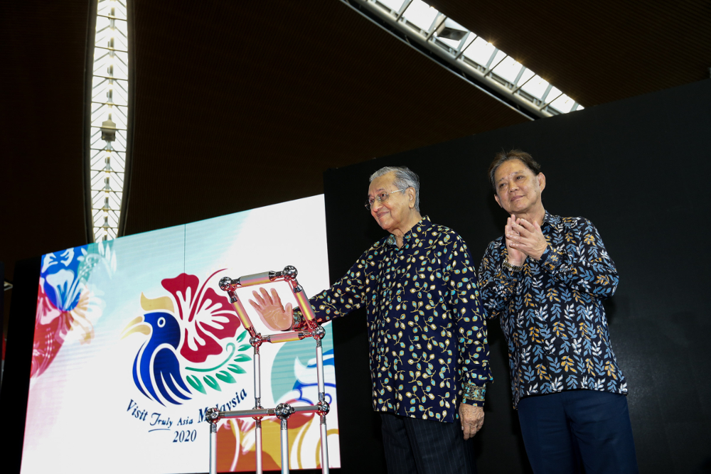 Tun Dr Mahathir Mohamad together with Tourism Minister Datuk Mohammadin Ketapi during the unveiling of the new Visit Malaysia 2020 logo at KLIA, Sepang July 22,2019. u00e2u20acu201d Picture by Ahmad Zamzahuri