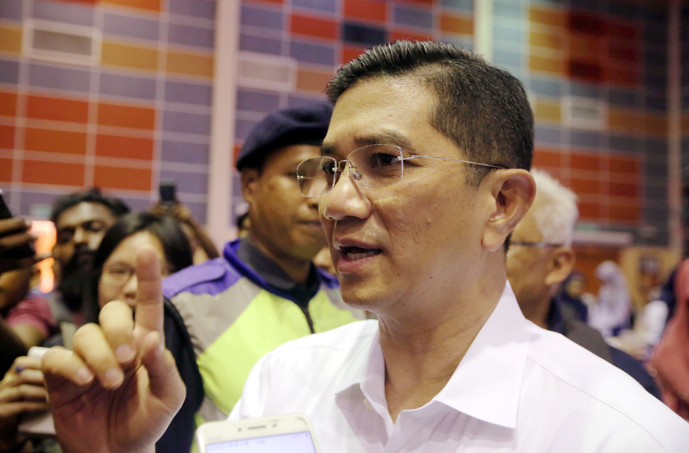 Economic Affairs Minister Datuk Seri Azmin Ali speaks to the press after visiting Felcra residents at the Dewan Besar Seberang Perak, Kampung Gajah July 22, 2019. u00e2u20acu201d Picture by Farhan Najib