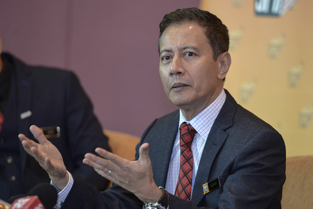 Election Commission chairman Azhar Azizan Harun speaks to the media during a press conference at Putrajaya International Convention Centre (PICC) in Putrajaya July 18, 2019. u00e2u20acu201d Picture by Shafwan Zaidon