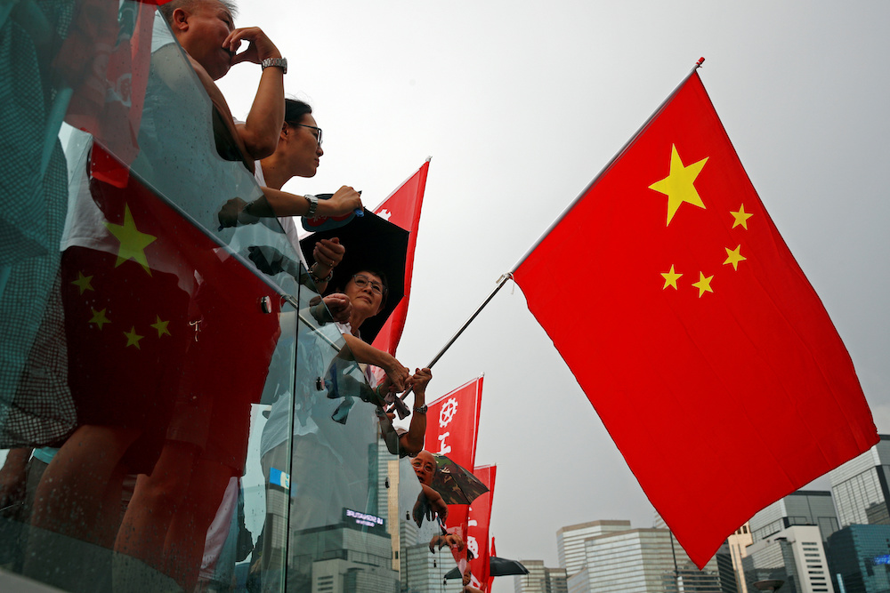 Pro-government supporters attend a rally to call for an end to violence, after a wave of protests against an extradition bill triggered clashes between police and activists, in Hong Kong, China July 20, 2019. u00e2u20acu201d Reuters picnn