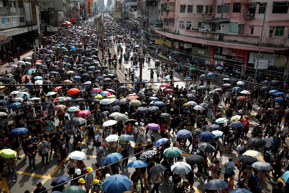 Demonstrators march during a protest against the Yuen Long attacks in Yuen Long, New Territories, Hong Kong, China July 27, 2019. u00e2u20acu201d Reuters picnn