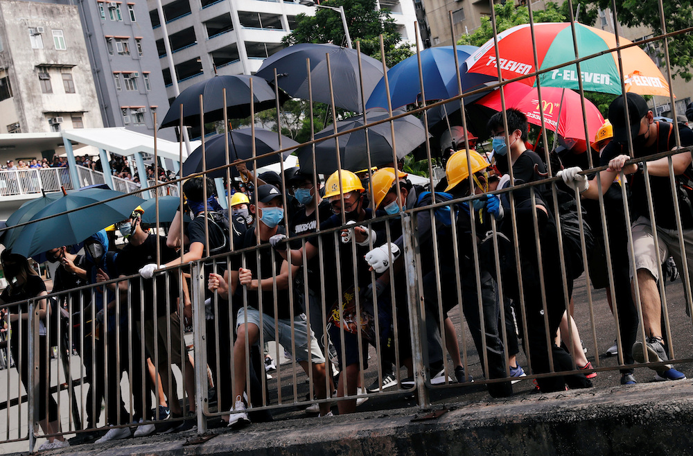Protesters pull down a fence near Nam Pin Wai village during a protest against the Yuen Long attacks in Yuen Long, New Territories, Hong Kong, China July 27, 2019. u00e2u20acu201d Reuters pic