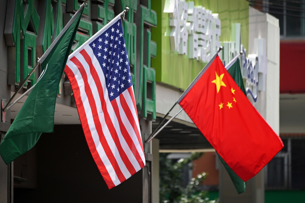 This file photo taken May 14, 2019 shows the US and Chinese flags displayed outside a hotel in Beijing. u00e2u20acu201d AFP pic 