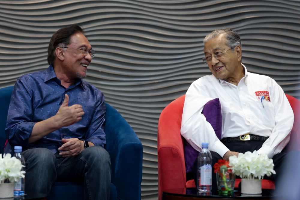 Datuk Seri Anwar Ibrahim speaks to Tun Dr Mahathir Mohamad during PKRu00e2u20acu2122s retreat at the Lexis Hibiscus resort in Port Dickson July 19, 2019. u00e2u20acu201d Picture by Ahmad Zamzahuri