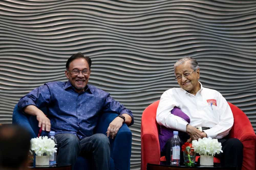 Datuk Seri Anwar Ibrahim and Tun Dr Mahathir Mohamad are pictured during PKRu00e2u20acu2122s retreat at the Lexis Hibiscus resort in Port Dickson July 19, 2019. u00e2u20acu201d Picture by Ahmad Zamzahuri