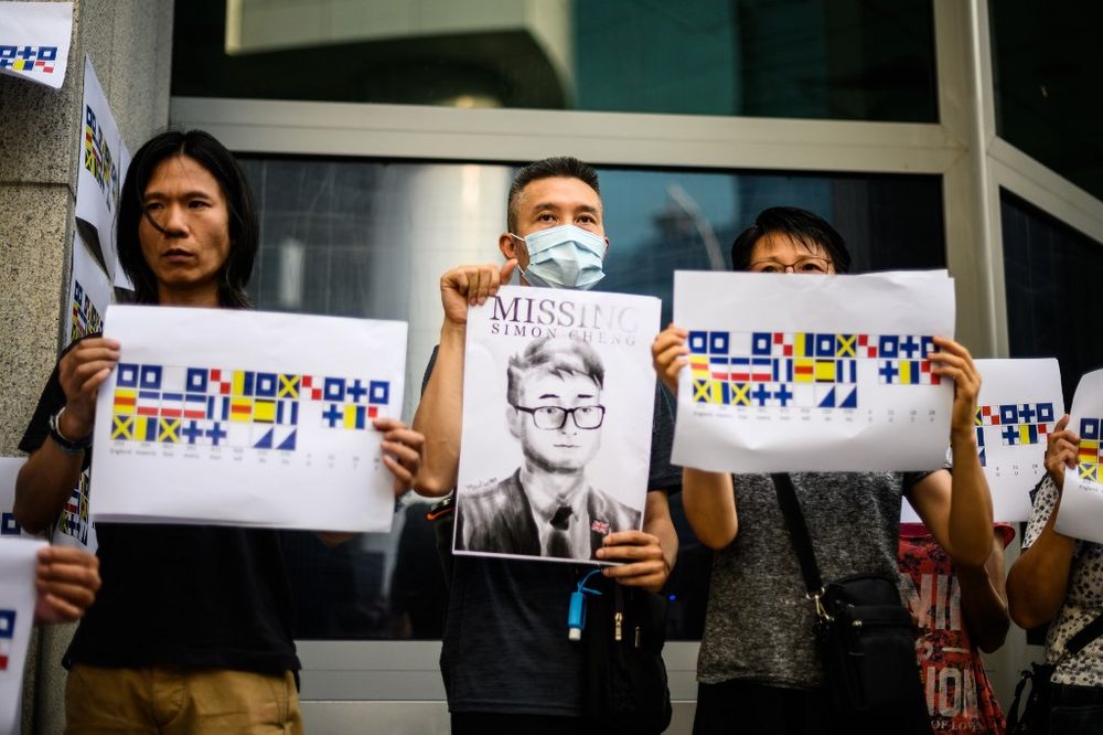 Activists holding placards u00e2u20acu201c one an illustration (centre) of Simon Cheng gather outside the British Consulate-General building in Hong Kong, August 21, 2019, following reports that the Hong Kong consulate employee had been detained. u00e2u20acu201d AFP pic