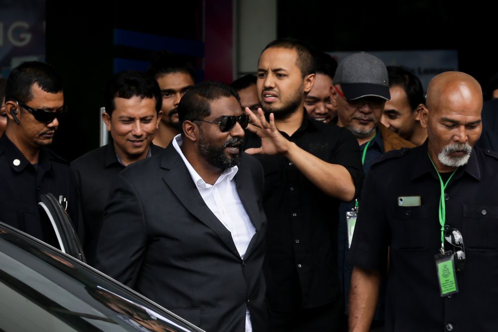 Farhash Wafa Salvador Rizal Mubarak waves to the crowd as he leaves the Dang Wangi police station in Kuala Lumpur July 23, 2019. u00e2u20acu2022 Picture by Ahmad Zamzahuri