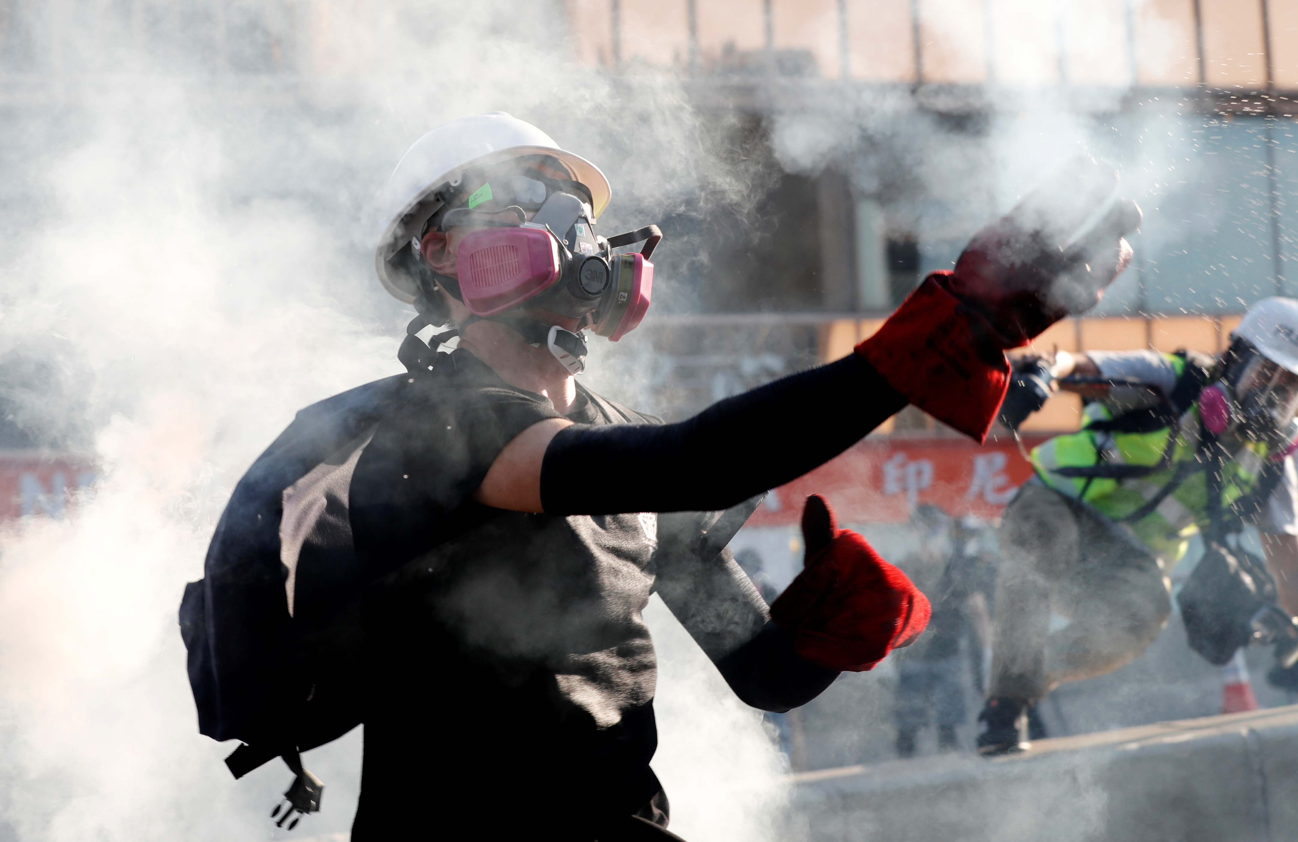 A protester throws a tear gas canister back at the police during a demonstration in support of the city-wide strike and to call for democratic reforms in Hong Kong, China, August 5, 2019. u00e2u20acu201d Reuters pic