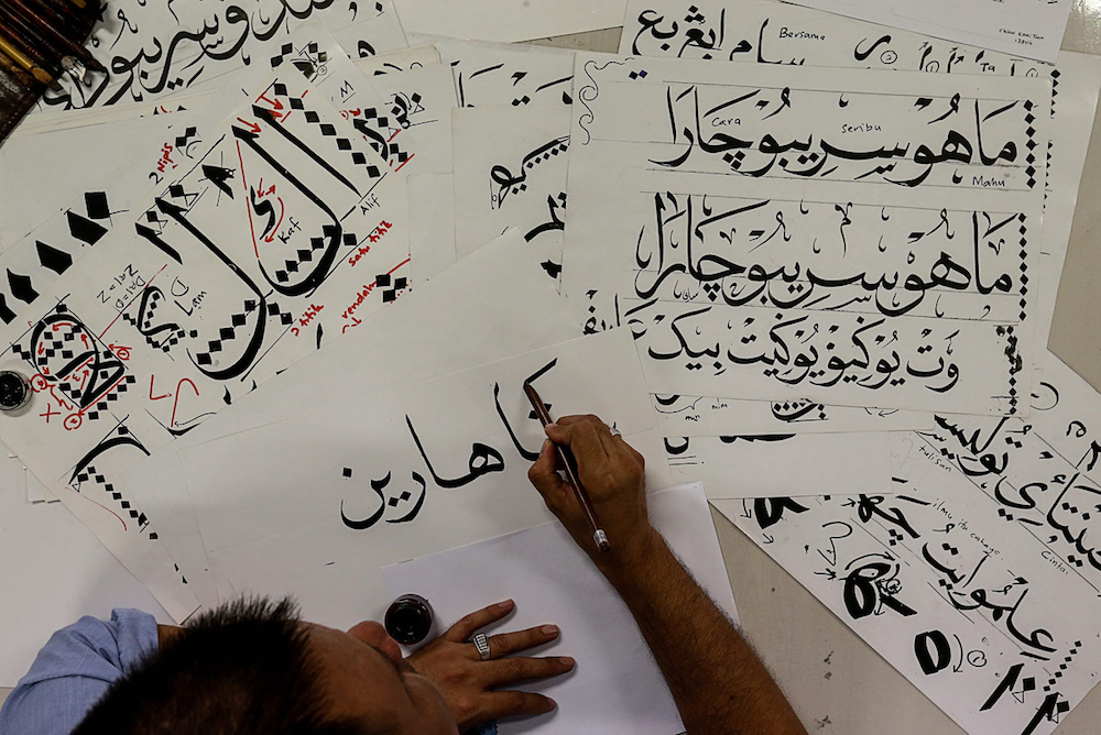 A man practises khat calligraphy in Balik Pulau, Penang August 6, 2019. u00e2u20acu201d Picture by Sayuti Zainudin