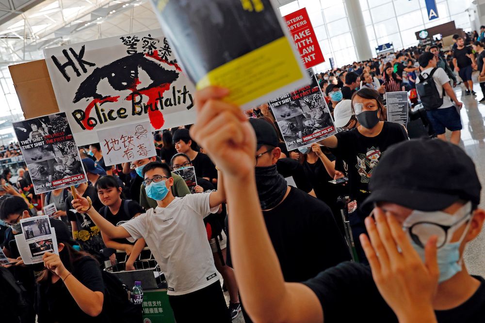 Anti-extradition bill protesters attend a mass demonstration after a woman was shot in the eye during a protest at Hong Kong International Airport, in Hong Kong August 12, 2019. u00e2u20acu201d Reuters pic