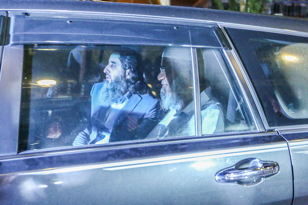 Islamic preacher Dr Zakir Naik (right) leaves Bukit Aman in Kuala Lumpur August 16, 2019. u00e2u20acu201d Picture by Firdaus Latif