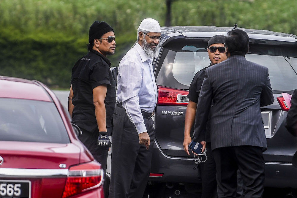 Dr Zakir Naik arrives at Bukit Aman police headquarters in Kuala Lumpur August 22, 2019. u00e2u20acu201d Picture by Hari Anggara