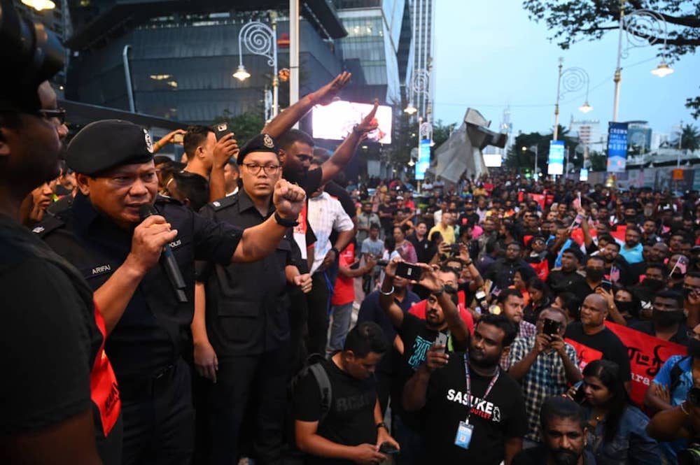 Police monitor a rally in Brickfields, Kuala Lumpur August 23, 2019.