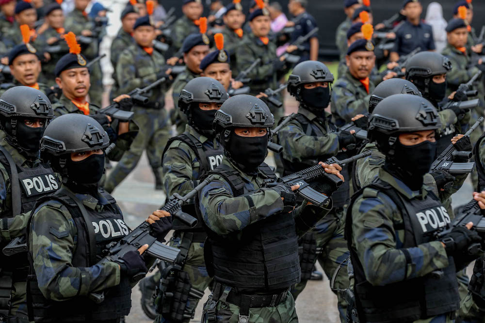 Royal Malaysia Police personnel march during a National Day rehearsal in Putrajaya August 29, 2019. u00e2u20acu201d Picture by Firdaus Latif