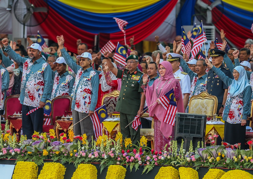 Yang di-Pertuan Agong Al-Sultan Abdullah Riu00e2u20acu2122ayatuddin Al-Mustafa Billah Shah, Raja Permaisuri Agong Tunku Hajah Azizah Aminah Maimunah Iskandariah and Prime Minister Mahathir Mohamad during the National Day Parade in Kuala Lumpur August 31, 2019.u00e2u20acu201dPict