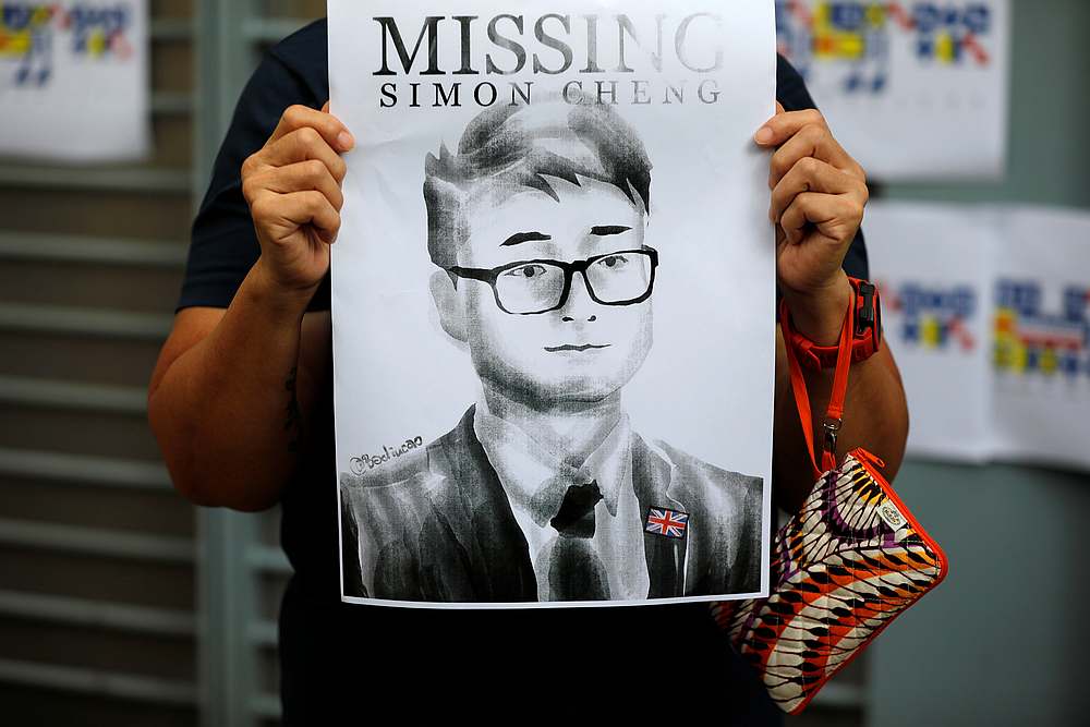 A woman holds a poster of Simon Cheng, who went missing on August 9 after visiting the neighbouring Shenzhen, during a protest outside the British Consulate-general office in Hong Kong August 21, 2019. u00e2u20acu201d Reuters pic