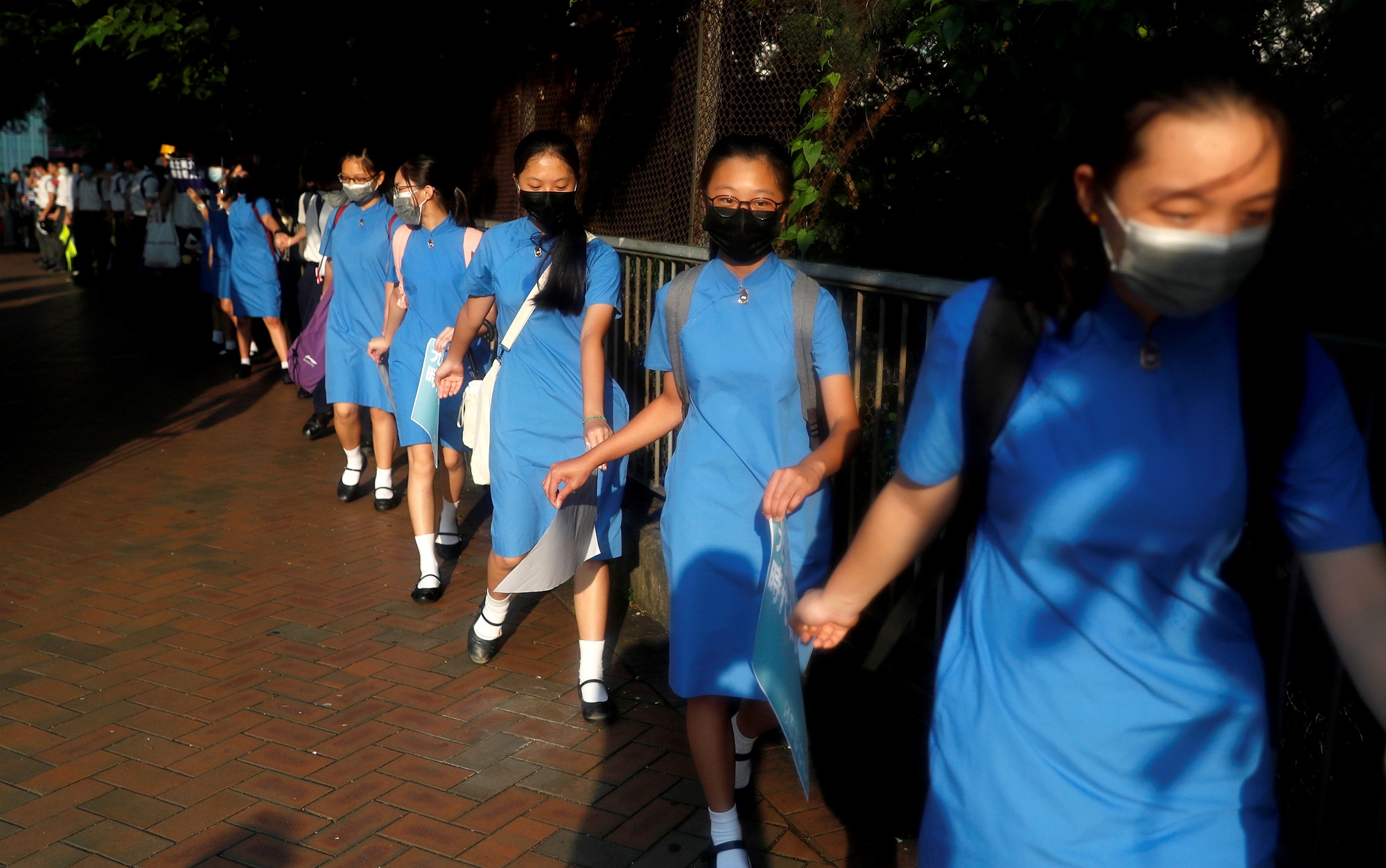 Secondary school students hold hands as they form a human chain as they demonstrate against what they say is police brutality against protesters, after clashes at Wan Chai district, in Hong Kong, China September 9, 2019. REUTERS/Amr Abdallah Dalsh