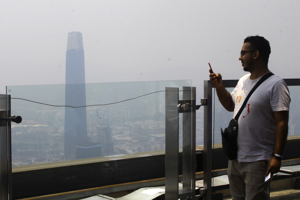 A tourist takes a photo of The Exchange 106 at Tun Razak Exchange in Kuala Lumpur September 5, 2019. u00e2u20acu201d Bernama pic