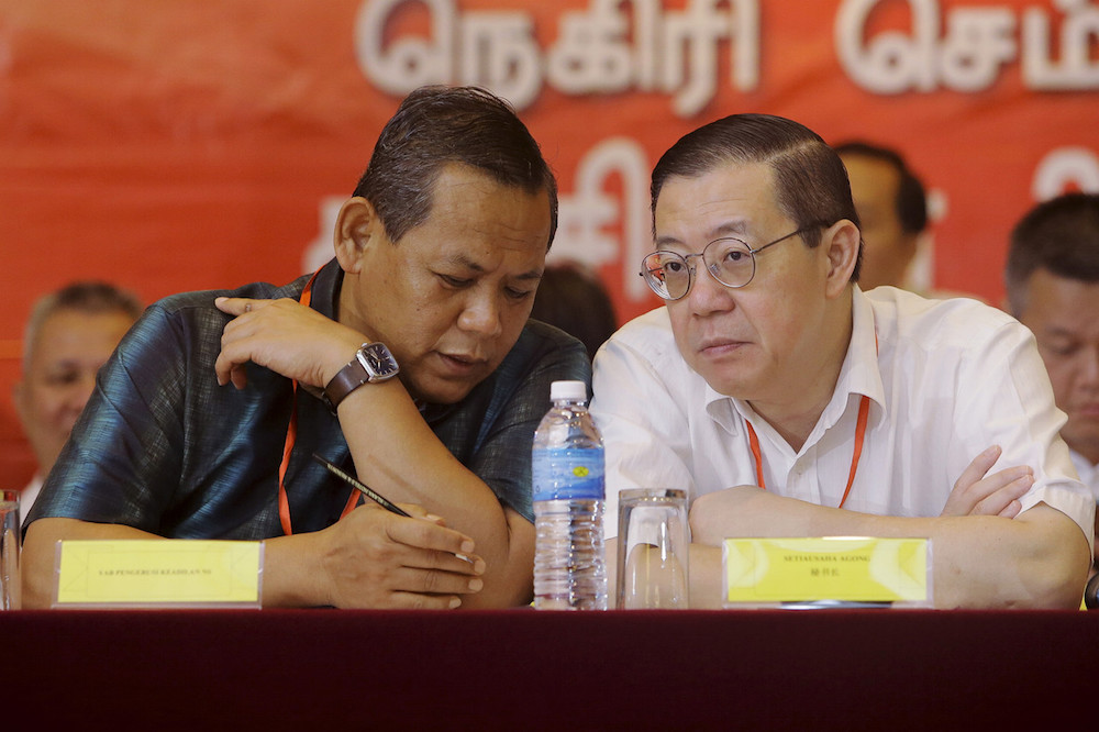 Negri Sembilan Mentri Besar Datuk Seri Aminuddin Harun and Finance Minister Lim Guan Eng chat during the 20th Negri Sembilan DAP Annual Convention in Seremban September 22, 2019. u00e2u20acu201d Bernama pic