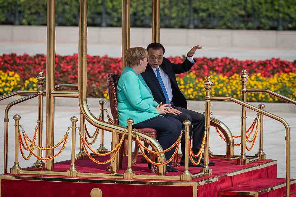 Chinese Premier Li Keqiang (right) talks with German Chancellor Angela Merkel during a welcome ceremony at the Great Hall of the People in Beijing September 6, 2019. u00e2u20acu201d AFP pic
