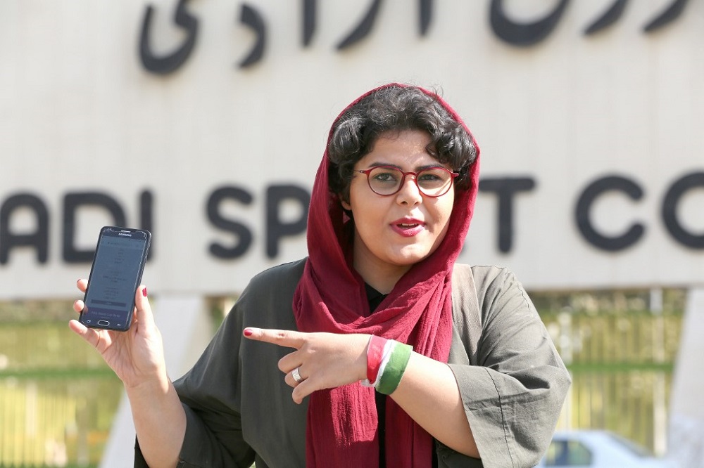 Iranian sports journalist Raha Pourbakhsh shows purchased electronic tickets for the Iran-Cambodia World Cup 2022 qualifier match during an interview with AFP in front of Azadi stadium in Tehran October 8, 2019. u00e2u20acu201d AFP pic