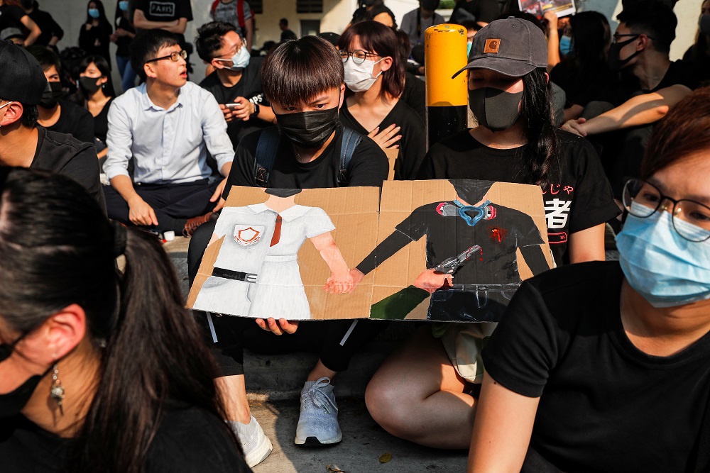 Alumnus of Tsuen Wan Public Ho Chuen Yiu Memorial College participate in a student gathering in the school in solidarity with the student protester who was shot by a policeman on Tuesday in Hong Kong October 2, 2019. u00e2u20acu201d Reuters pic