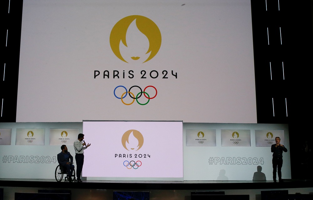 Tony Estanguet, President of the Paris Organising Committee of the 2024 Olympic and Paralympic Games, speaks next to paralympic athlete Michael Jeremiasz during a ceremony to present the new logo of the Paris 2024 Olympics in Paris October 21, 2019. u00e2u20acu201d R