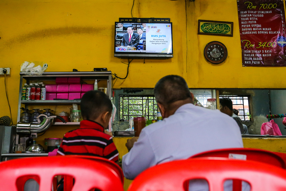 People watch a u00e2u20acu02dcliveu00e2u20acu2122 telecast of the tabling of Budget 2020 by Finance Minister Lim Guan Eng at an eatery in Kuala Lumpur October 11, 2019. u00e2u20acu201d Picture by Firdaus Latif