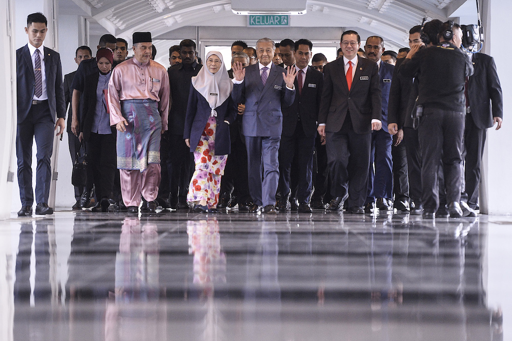 Prime Minster Tun Dr Mahathir Mohamad, Deputy Prime Minister Datuk Seri Dr Wan Azizah Wan Ismail and Finance Minister Lim Guan Eng arrive in Parliament for the tabling of Budget 2020 on October 11, 2019. u00e2u20acu201d Picture by Miera Zulyana