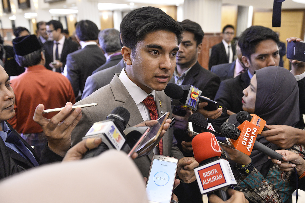 Syed Saddiq Abdul Rahman speaks to reporters in Parliament after the tabling of Budget 2020 on October 11, 2019. u00e2u20acu201d Picture by Miera Zulyana