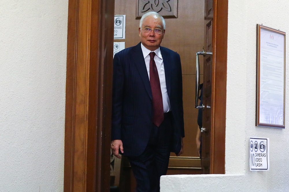 Former Prime Minister Datuk Seri Najib Razak walks out of the courtroom for a break at the Kuala Lumpur High Court Complex October 14, 2019. u00e2u20acu201d Picture by Yusof Mat Isa