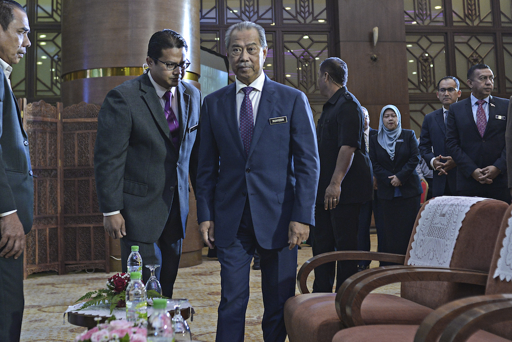 Home Minister Tan Sri Muhyiddin Yassin arrives to officiate National Registration Day at the National Registration Department in Putrajaya October 16, 2019. u00e2u20acu201d Picture by Shafwan Zaidon