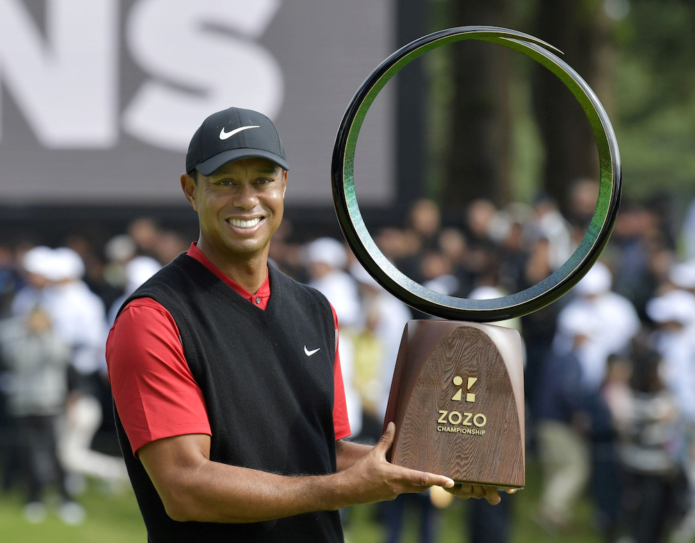 Tiger Woods holds a winning trophy as he celebrates to win the Zozo Championship, a PGA Tour event, at Narashino Country Club in Inzai October 28, 2019, in this photo released by Kyodo. u00e2u20acu201d Mandatory credit Kyodo via Reuters