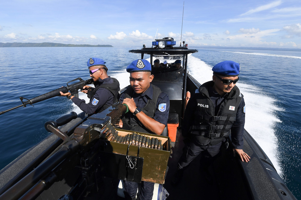 Marine police conduct a search and rescue operation in the sea off Tungku in Lahad Datu, Sabah October 26, 2019. u00e2u20acu201d Bernama pic