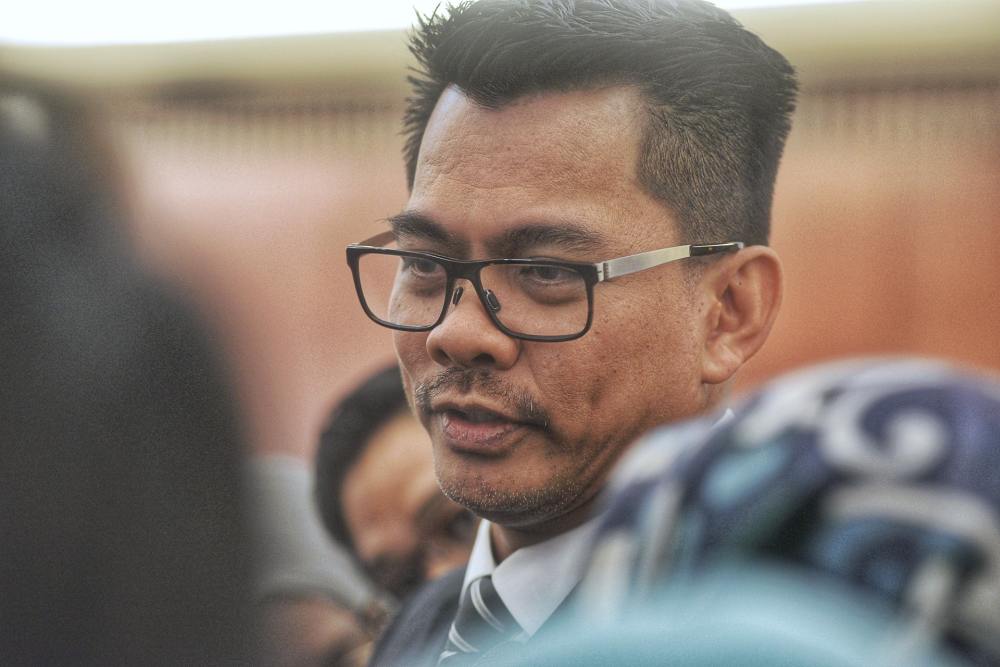 Deputy Minister of Home Affairs Datuk Mohd Azis Jamman speaks to reporters at the Parliament lobby October 15, 2019.  u00e2u20acu2022 Picture by Ahmad Zamzahuri